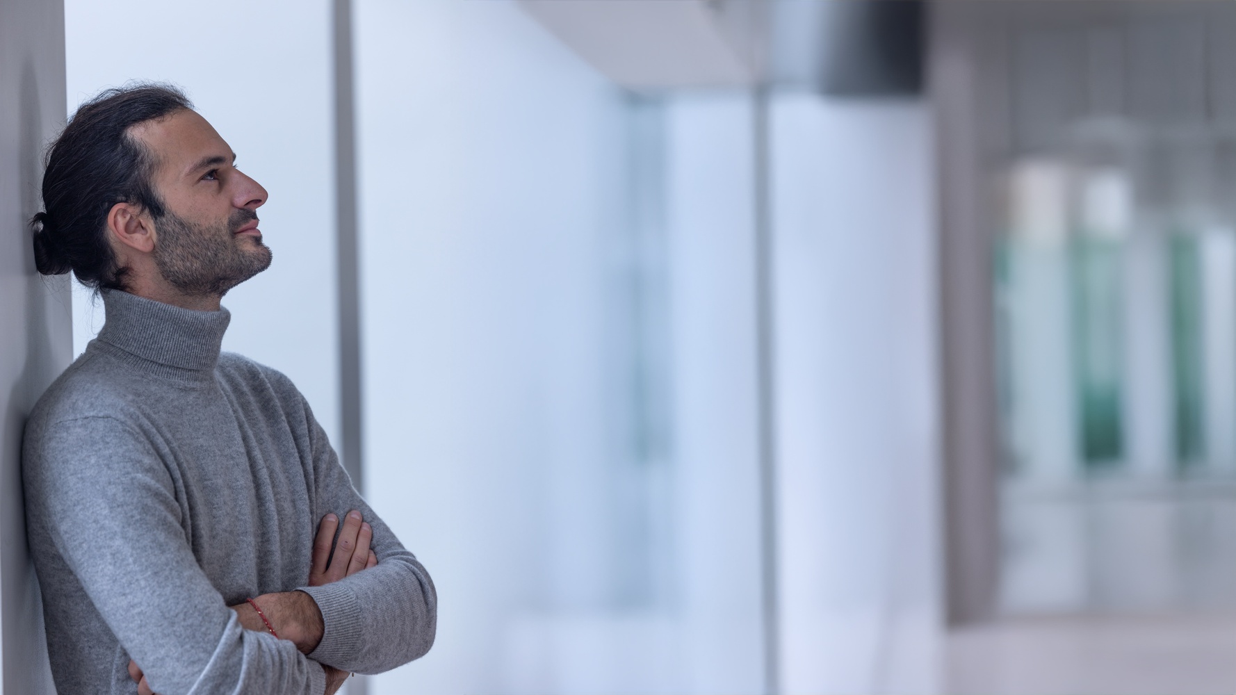 A salesperson with a calm, confident gaze in a bright space